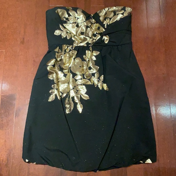 Black with gold strapless cocktail dress, gold shimmer through black under light - Picture 1 of 3
